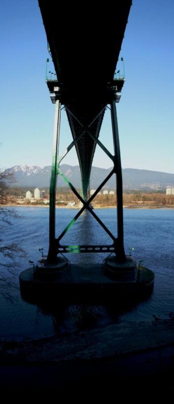 Vertical pan of the Lion's Gate Bridge taken from underneath