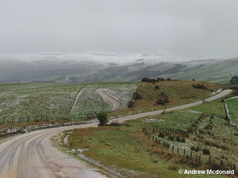 Hail/slushy snow with snow-covered Bass hills in the background (250m ASL).