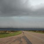 Low, green guster down the road to the west.  Andrews, Texas.