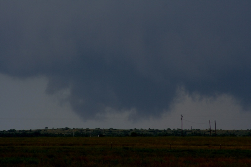 The wall cloud drags along the ground again.  Looking west from near Woodson, Tx.