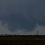 The wall cloud drags along the ground again.  Looking west from near Woodson, Tx.