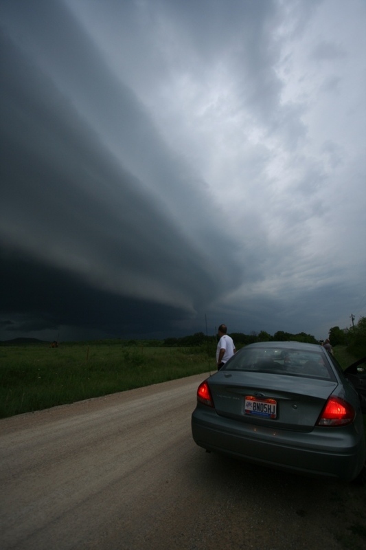 "The Boat" (chase car) and Chris watch as the shelfie gets close again.  East of Graham, Tx.