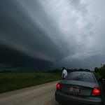 "The Boat" (chase car) and Chris watch as the shelfie gets close again.  East of Graham, Tx.