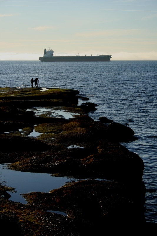 Rocky platforms jut out into the Pacific Ocean on the western side of Stanley Park