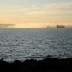 Ships being enveloped by a thick sea fog