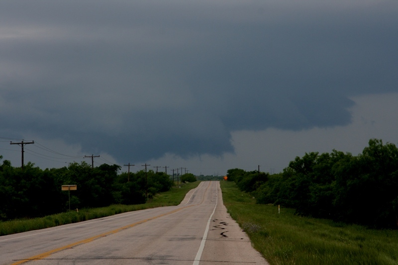 The wall cloud takes another trip across the tree tops.  Near Throckmorton, Tx.