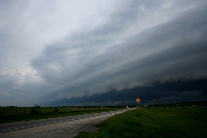 The squall line eventually ate the second storm but continued to produce a spectacular shelf cloud.  Near Graham, Tx.
