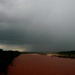 Pulse storm over the Red River (looking very red).  Oklahoma is on the right, Texas on the left.  Taken from near Courtney, OK.